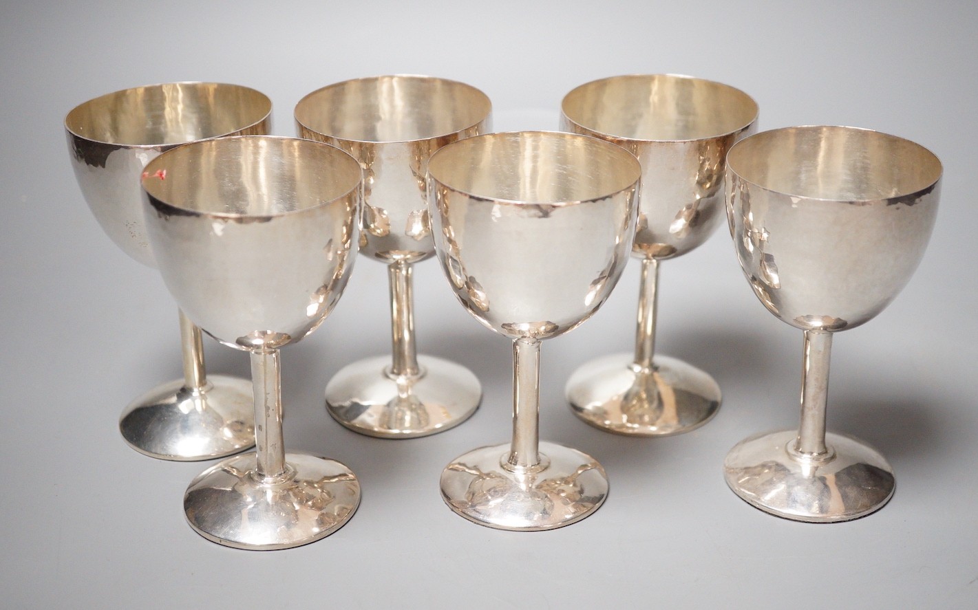 A matched set of six modern silver goblets, maker JR, London, 1978(4 Brittania standard) and 1984(2), height 10.6cm, weighted.